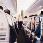 Where to sit on an airplane to avoid the flu while flying
